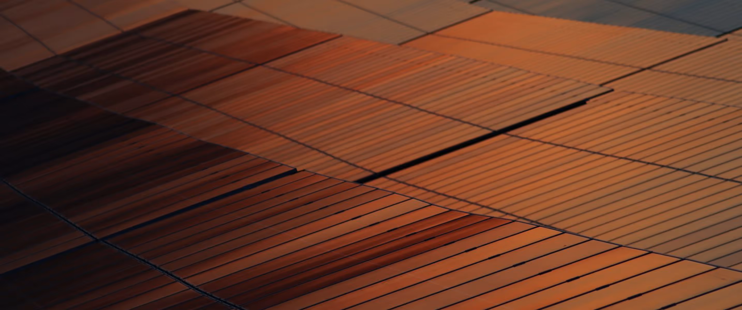 Close-up of textured, overlapping orange-brown tiles arranged in a geometric pattern.