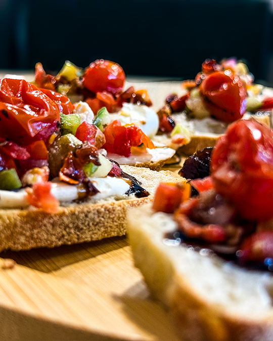 Mediterranean bruschetta with diced tomatoes and balsamic glaze drizzle