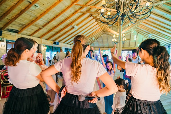 Women dancing and singing at a party