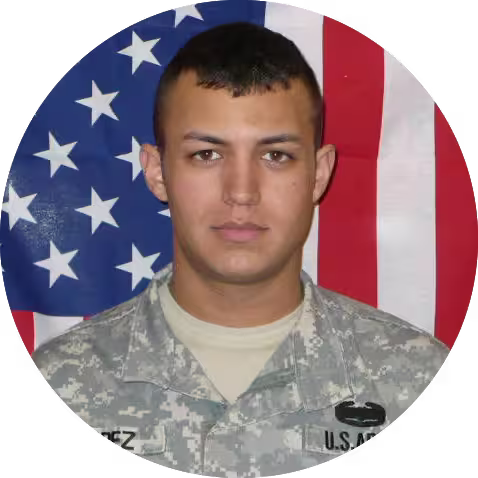 A photo of Robert Lopez in his U.S. Army uniform with an american flag background