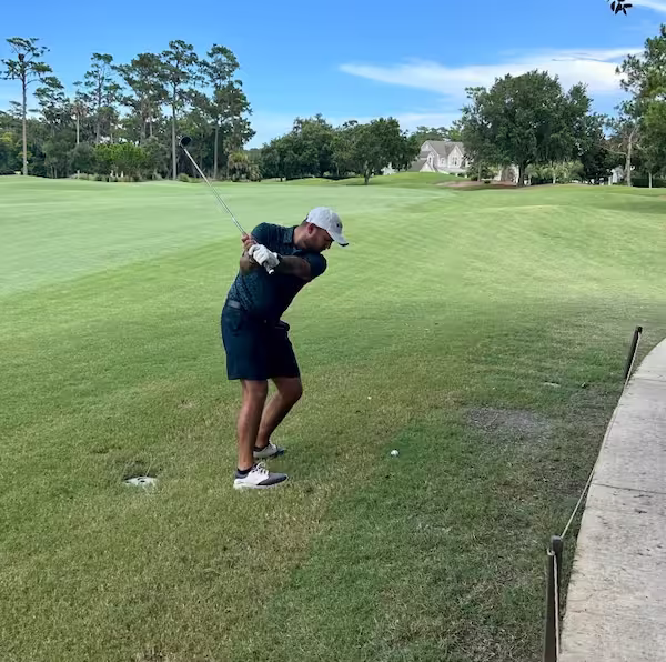 Robert Lopez golfing at TPC Sawgrass