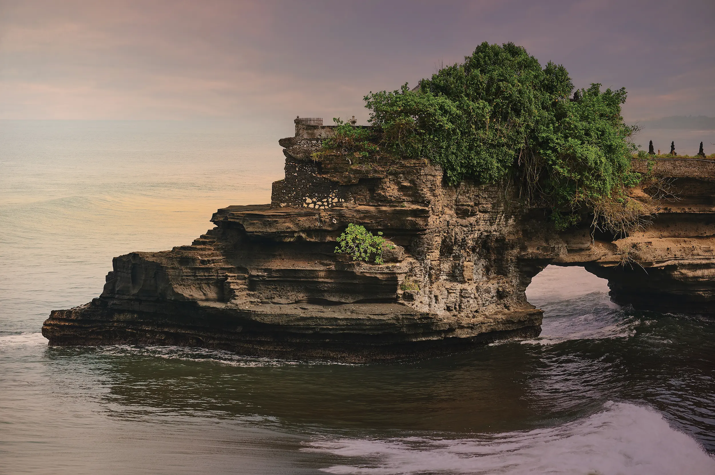 Pura Batu Bolong Temple arches majestically between the Java and Flores Seas.