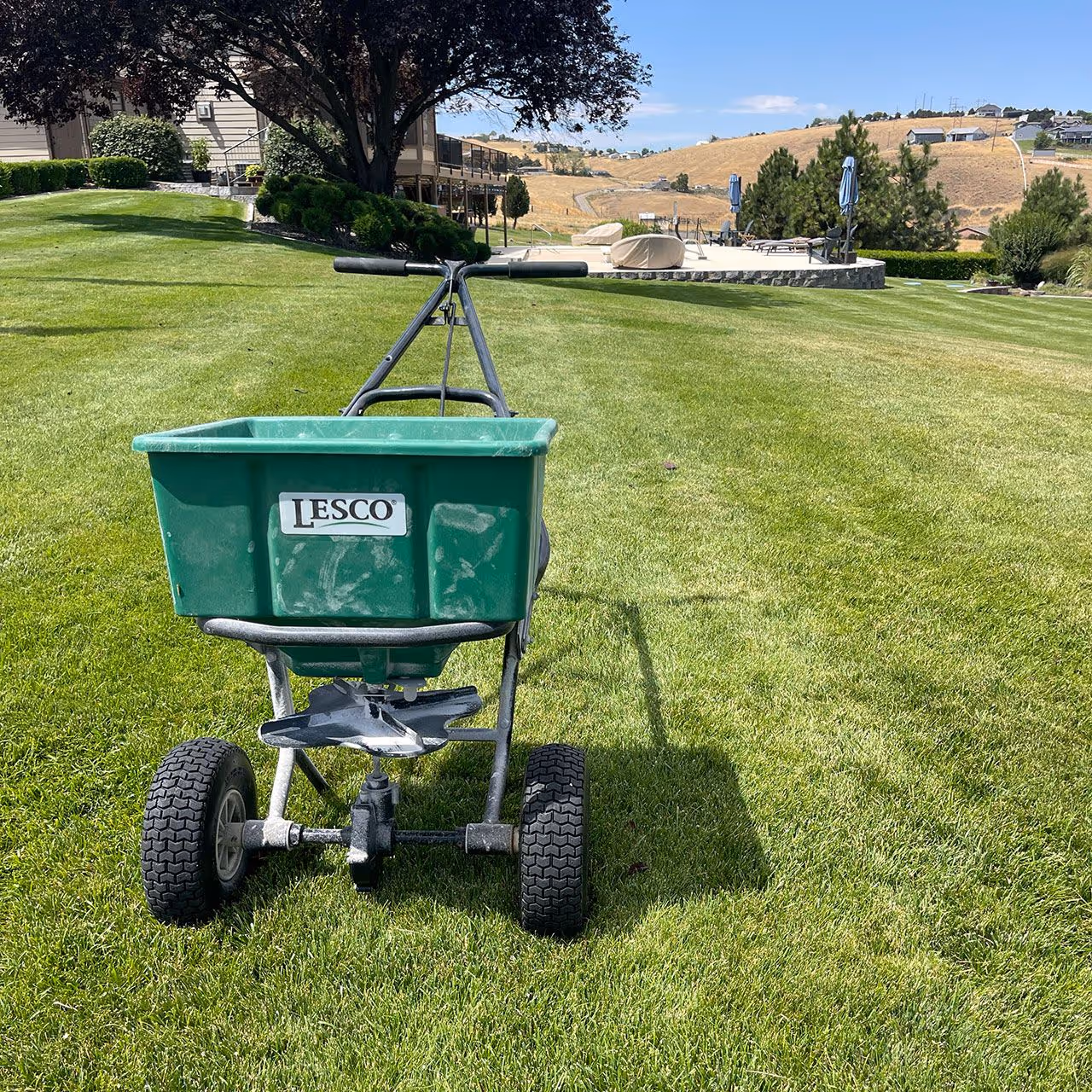 Turf fertilization and weed control lawn maintenance service