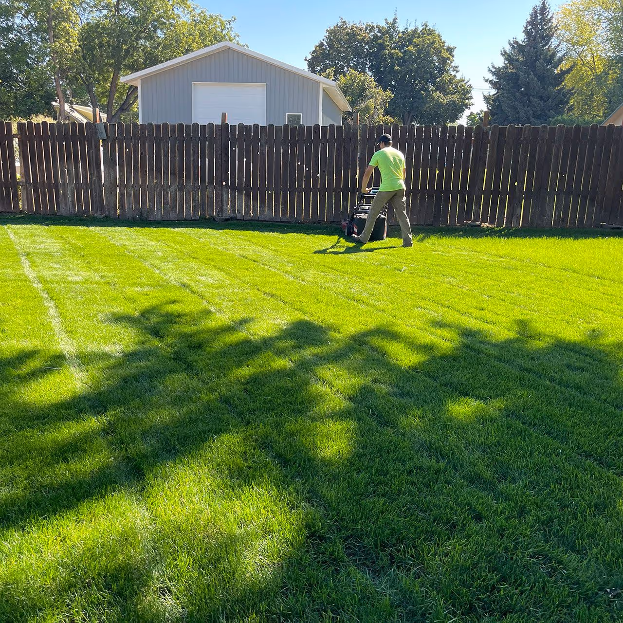 Residential lawn mowing for business property maintenance