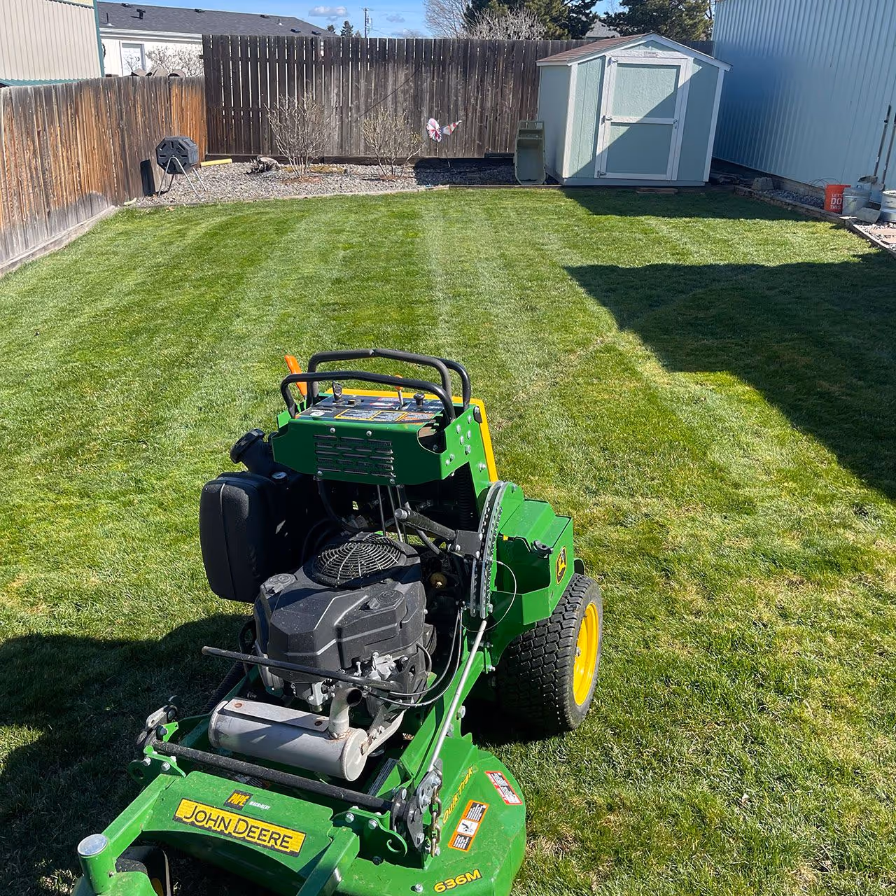 Healthy, manicured lawn maintained by Two Rivers Lawn Care & Landscaping