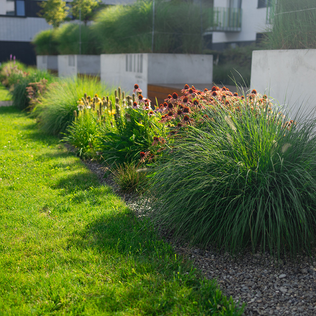 Landscape maintenance shrub trimming by Two Rivers Lawn Care