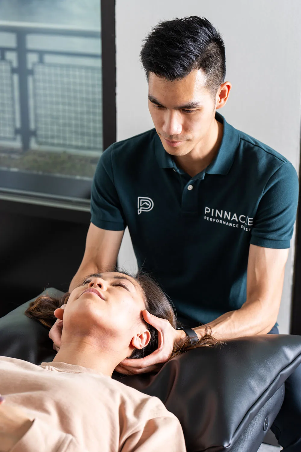 provider coaching athlete through performance-based recovery exercises