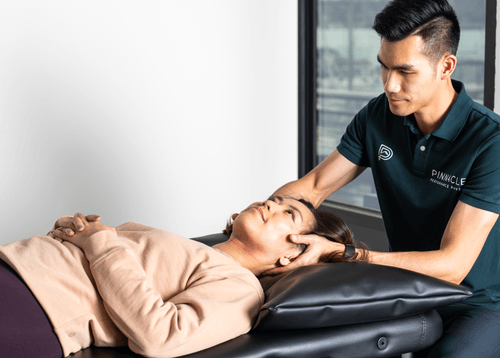 Patient receiving manual therapy treatment at a physical therapy clinic in Bellevue, WA