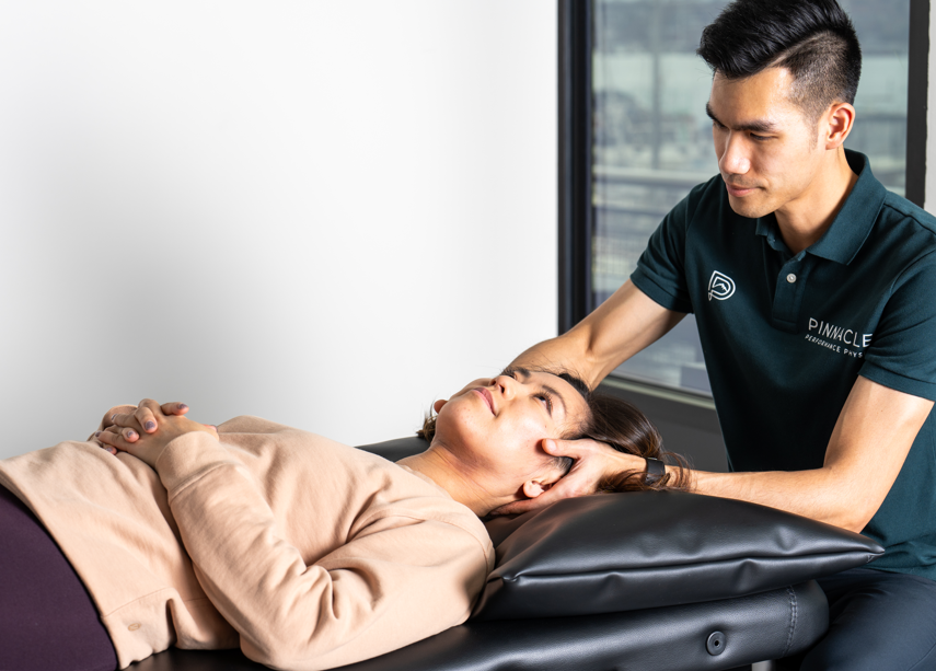  Patient receiving manual therapy treatment at a physical therapy clinic in Bellevue, WA