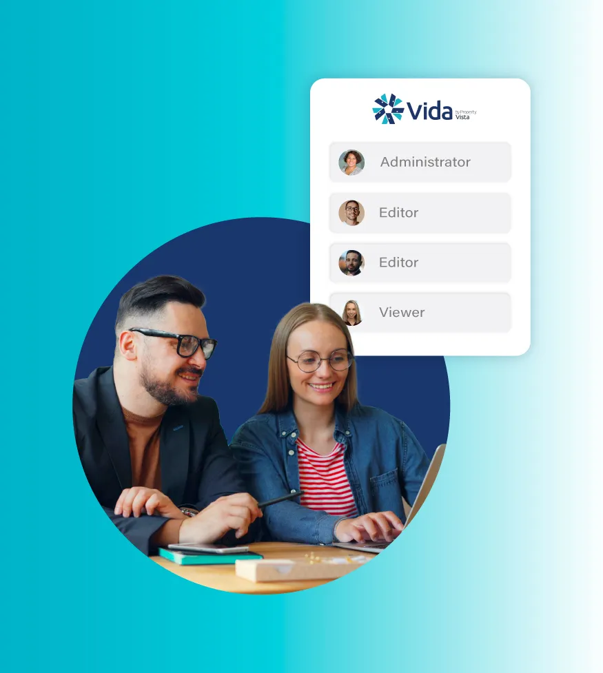 Two people wearing glasses working on a laptop with a user roles menu labeled Vida above them.