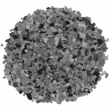 Circular pile of small multishaded gray and black flakes on white background.