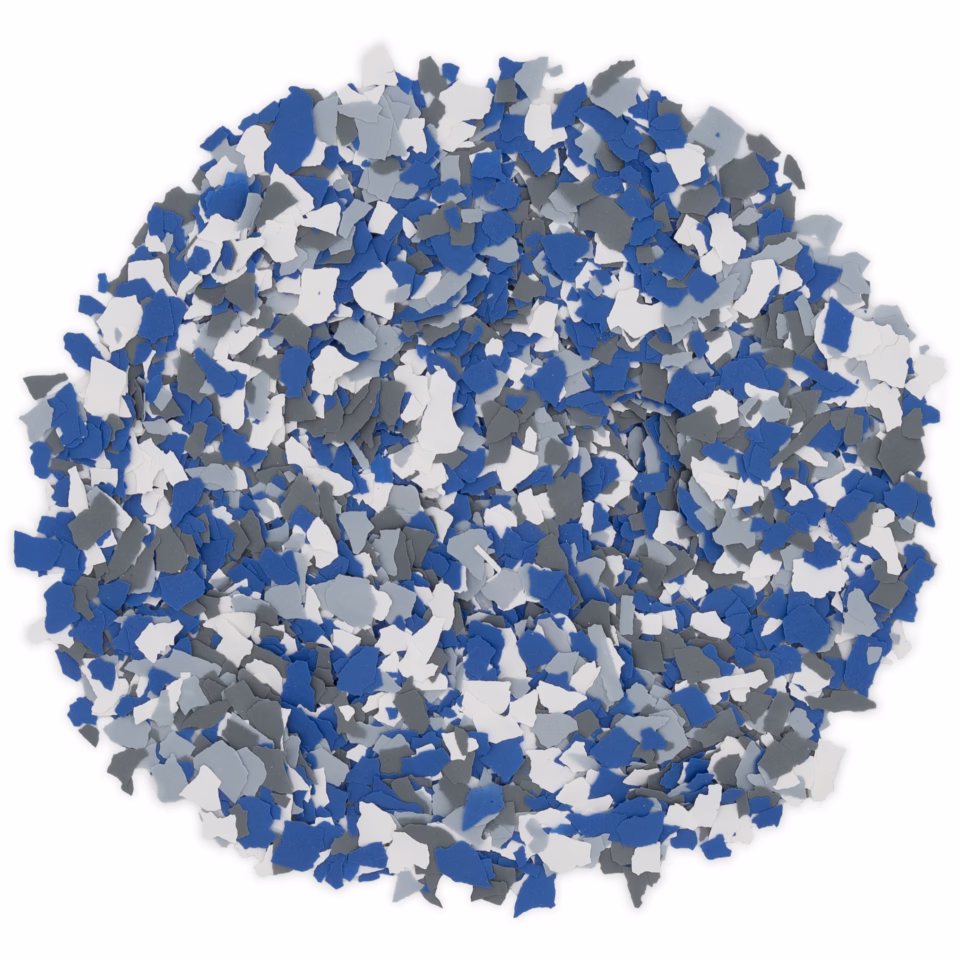 Close-up of blue, white, and gray vinyl chips scattered in a pile on a white background.