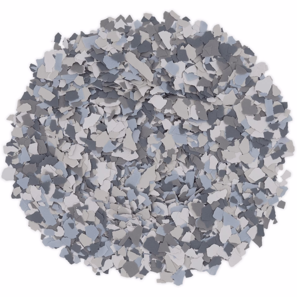 Pile of grey and white irregularly shaped flakes on a white background.