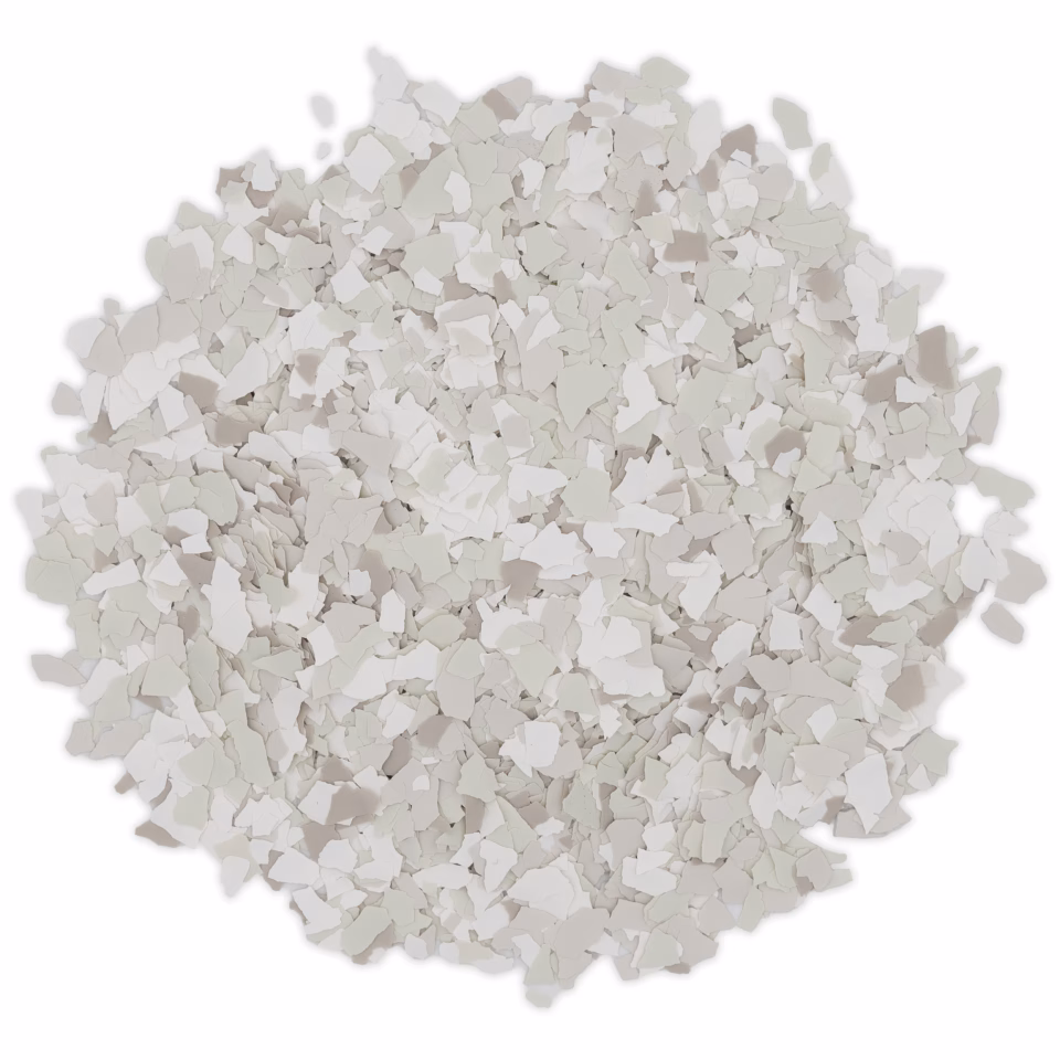 Pile of white and light gray terrazzo chips used for flooring or decorative surfaces.