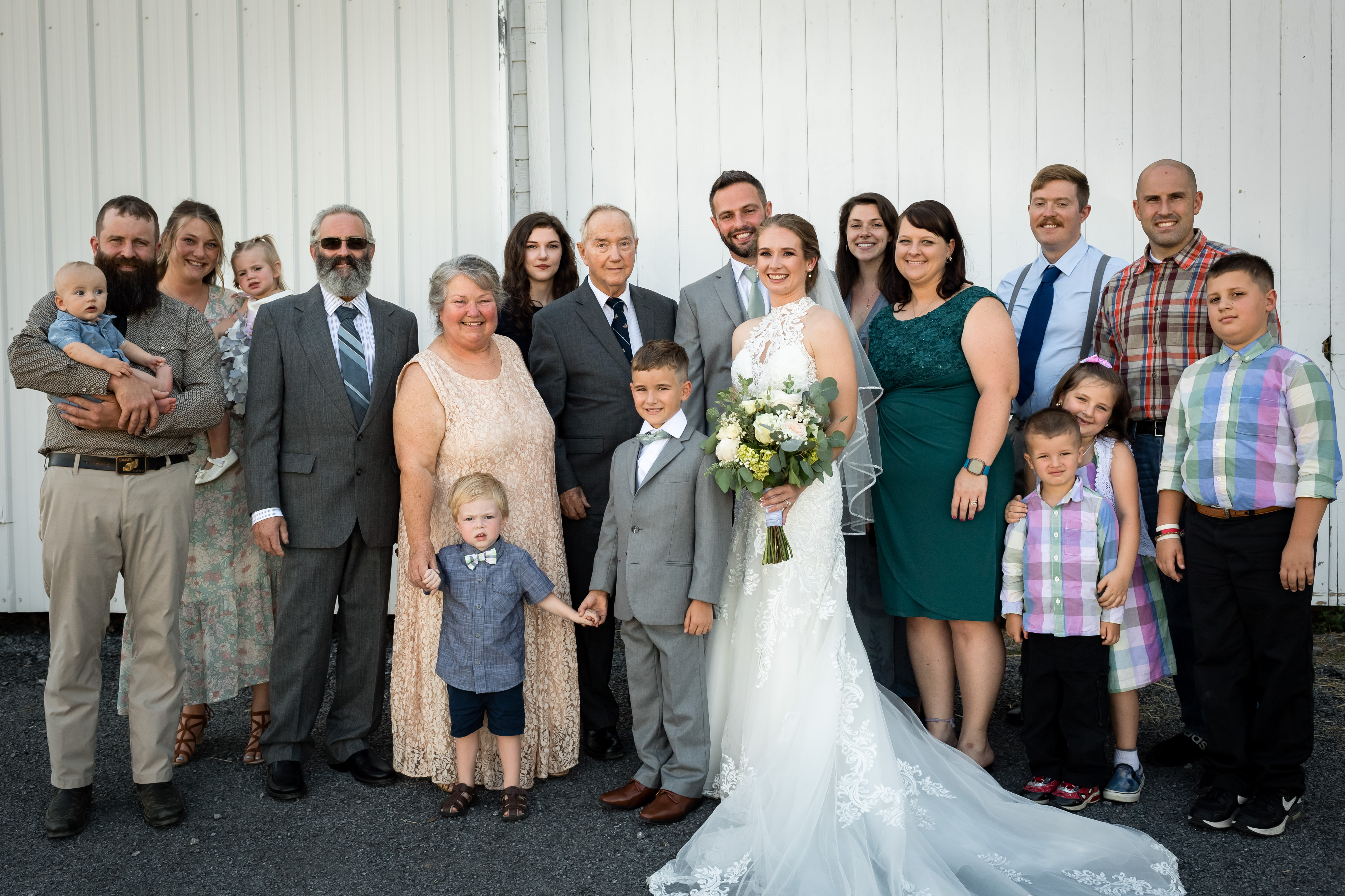 Extended family portrait at a farmhouse wedding reception in New York