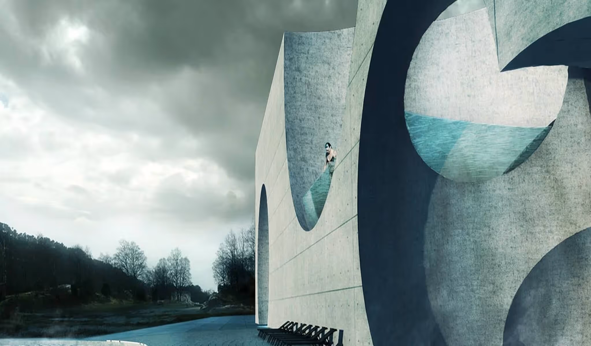Modern building with a large round pool-like indentation holding water and a person inside it.