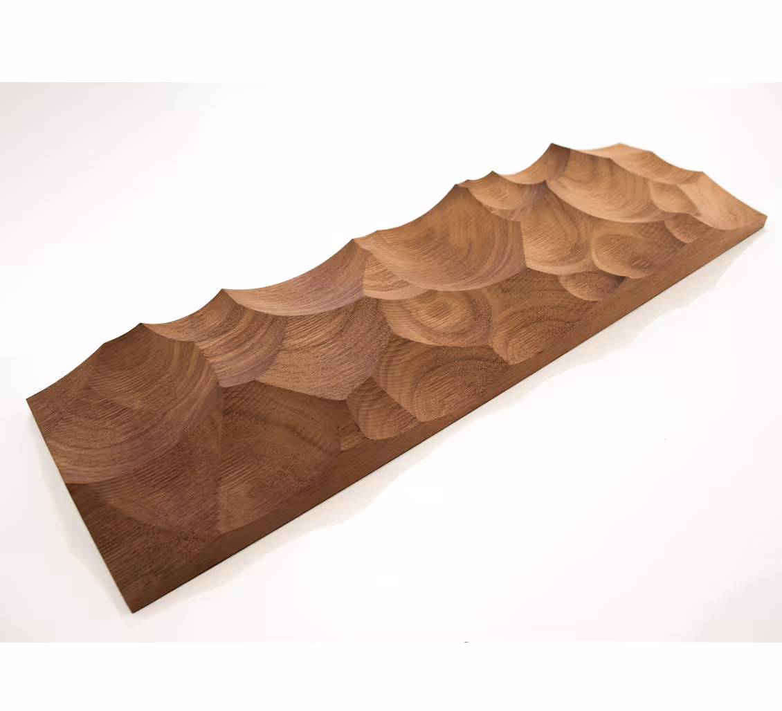 Rectangular wooden tray with a carved, scalloped textured surface and smooth edges.