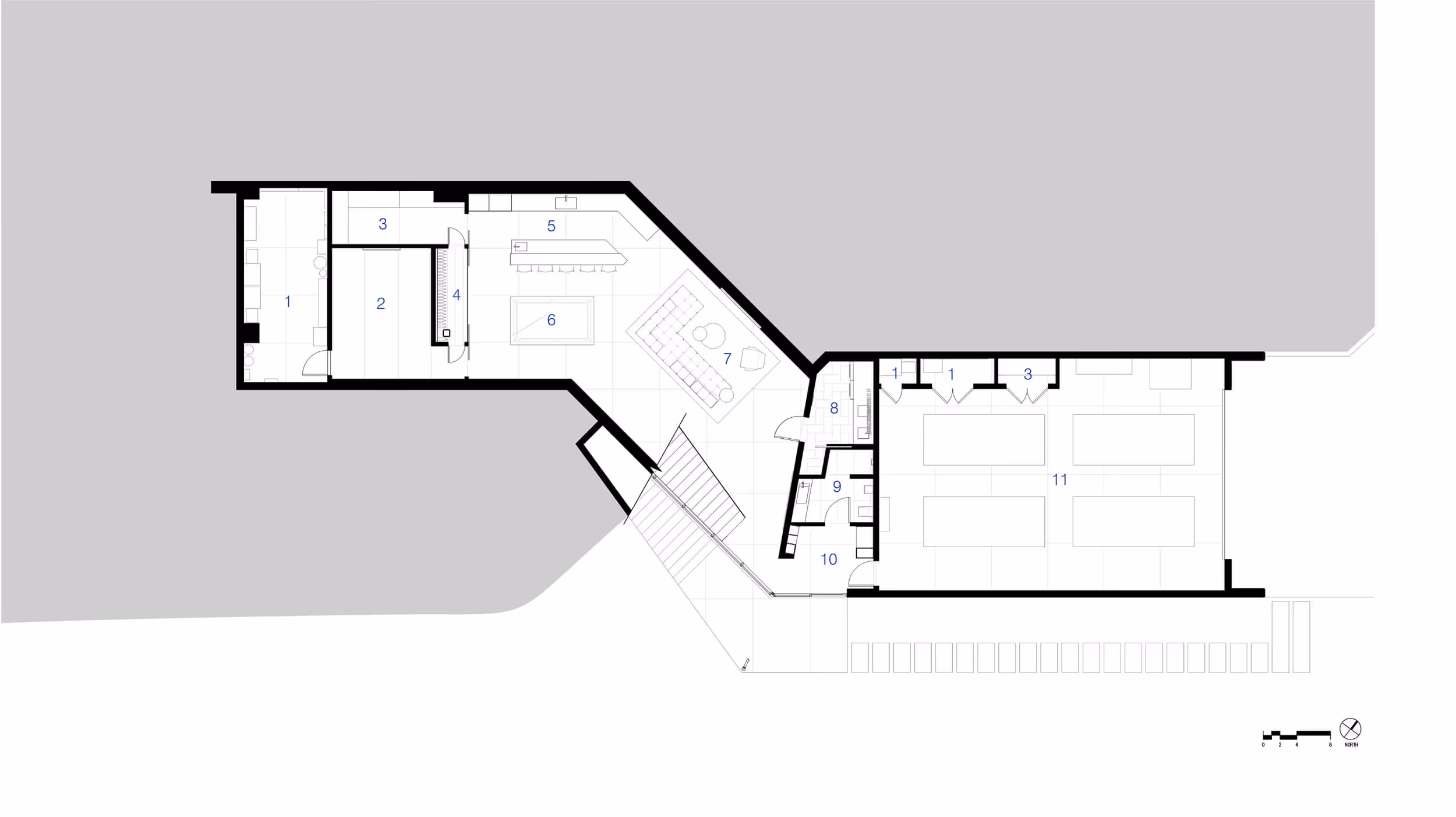 Architectural floor plan showing multiple rooms, stairway, and numbered areas within a building layout.