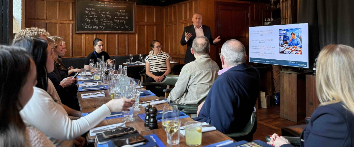 Greg Savage giving a presentation in London