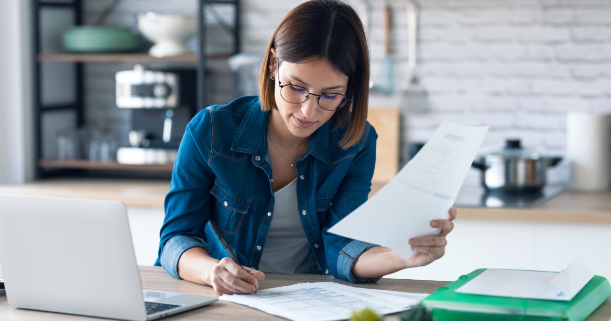 Woman writing invoice