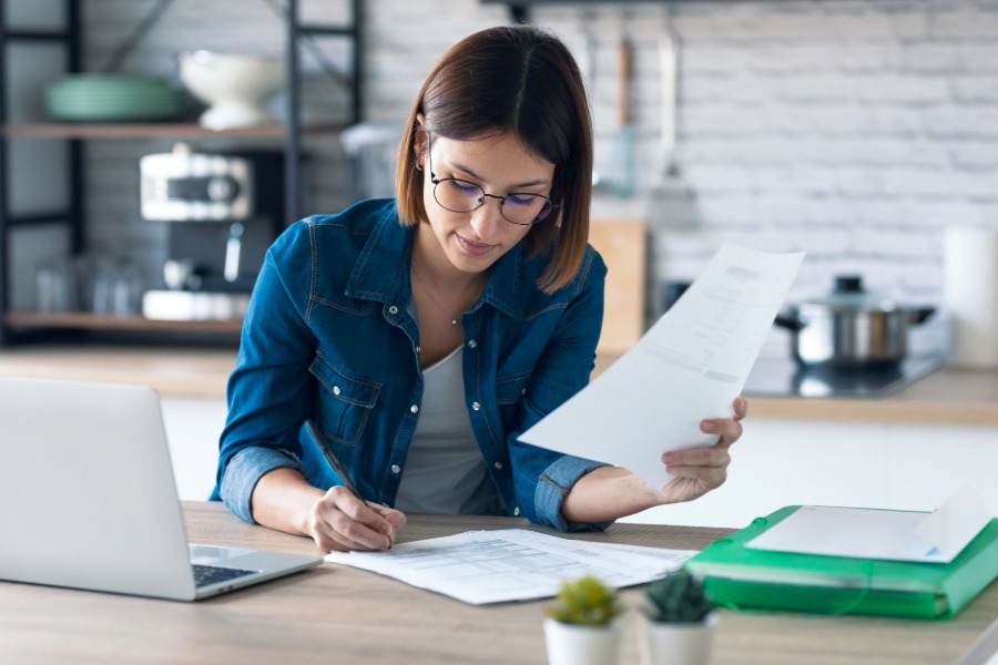 Woman writing invoice