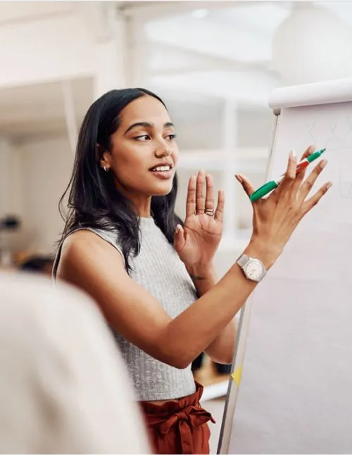 Woman standing at white board