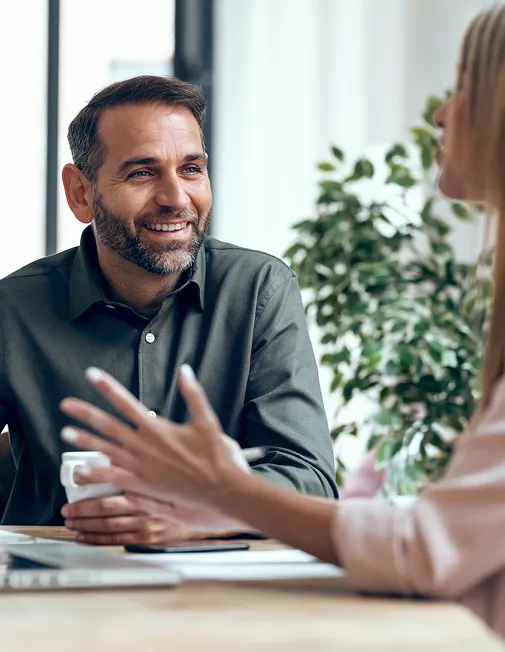 Man and woman chatting in a meeting