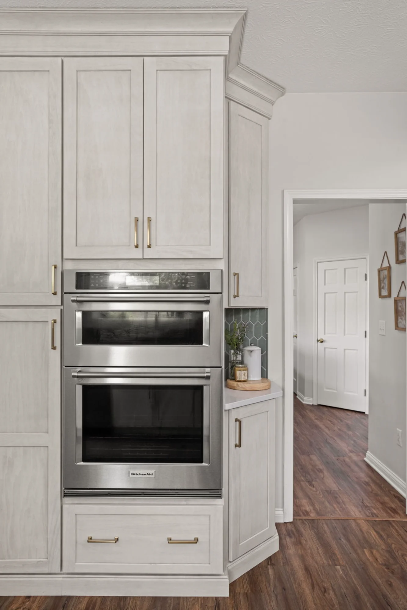 Built-in double wall ovens in white kitchen