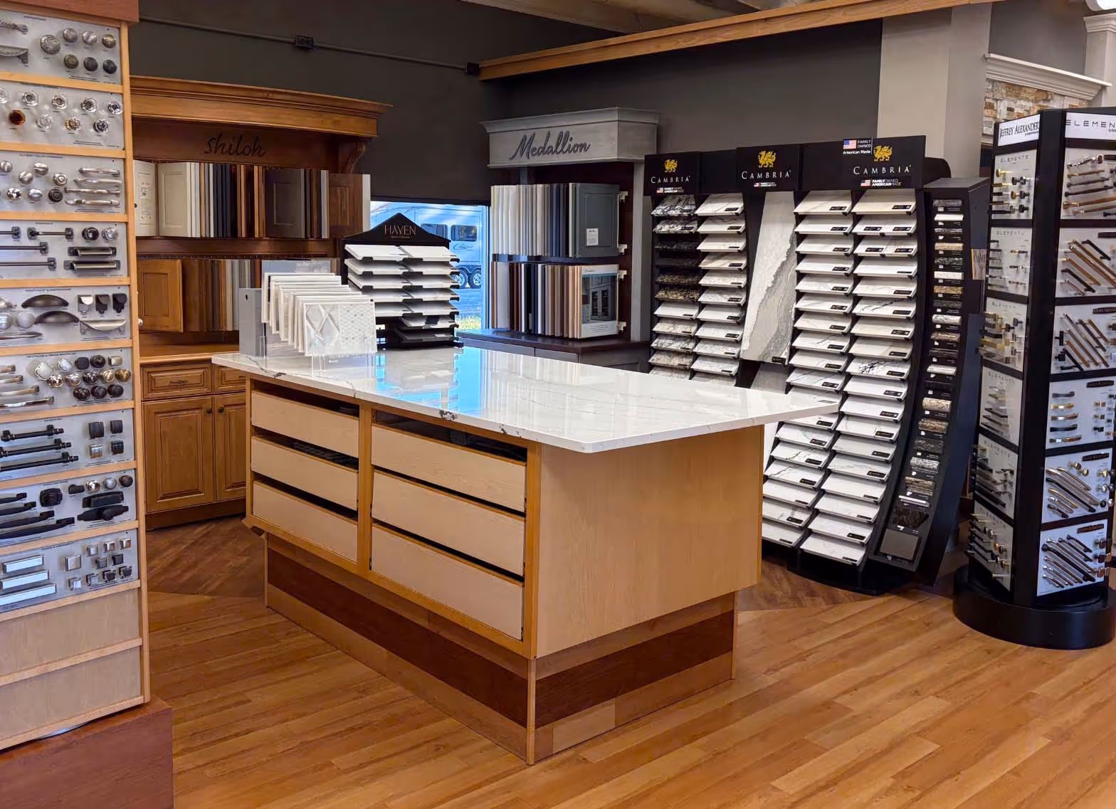Kitchen showroom display with sample cabinets and countertops