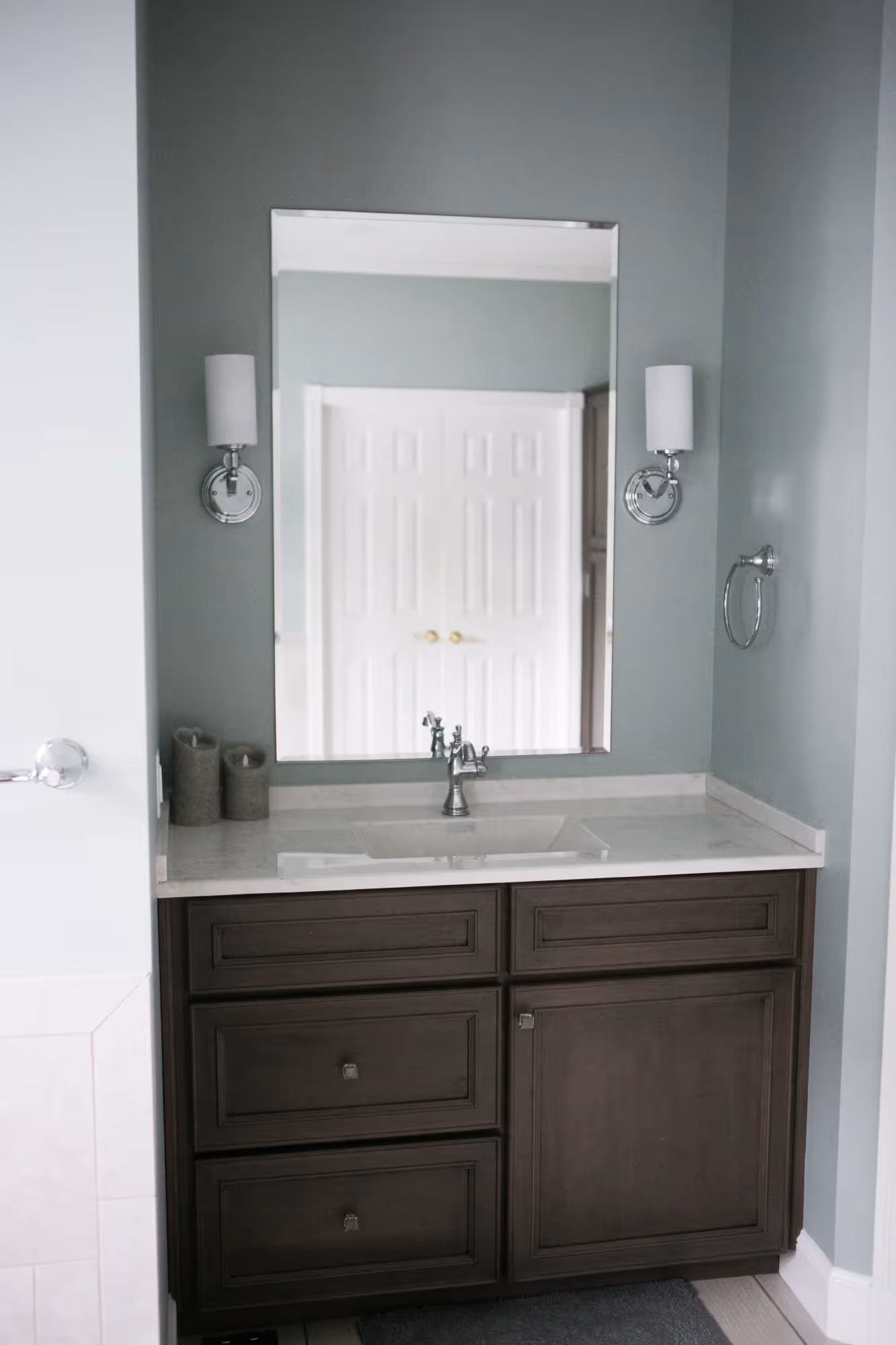 Bathroom vanity with a mirror and sink.