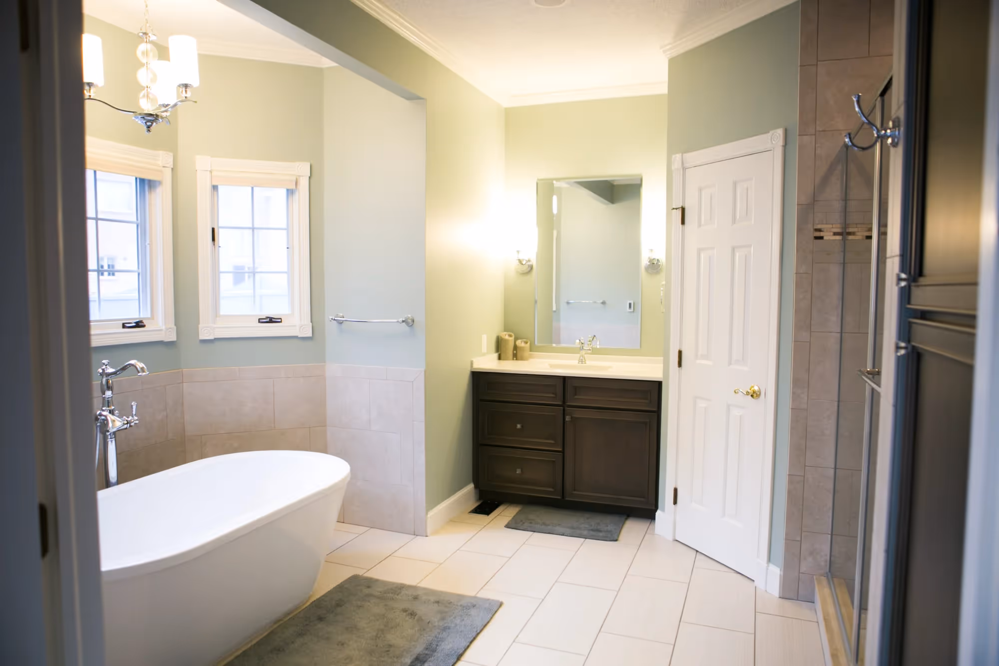 Bathroom with a vanity, sink, and mirror.