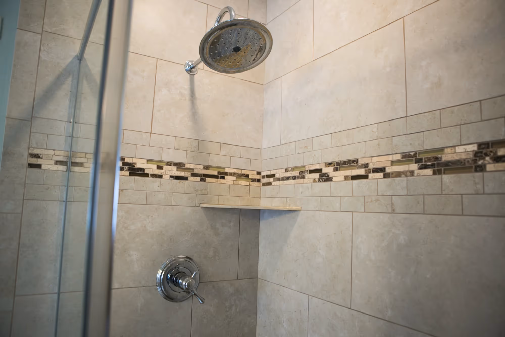 Overhead view of shower with glass door.