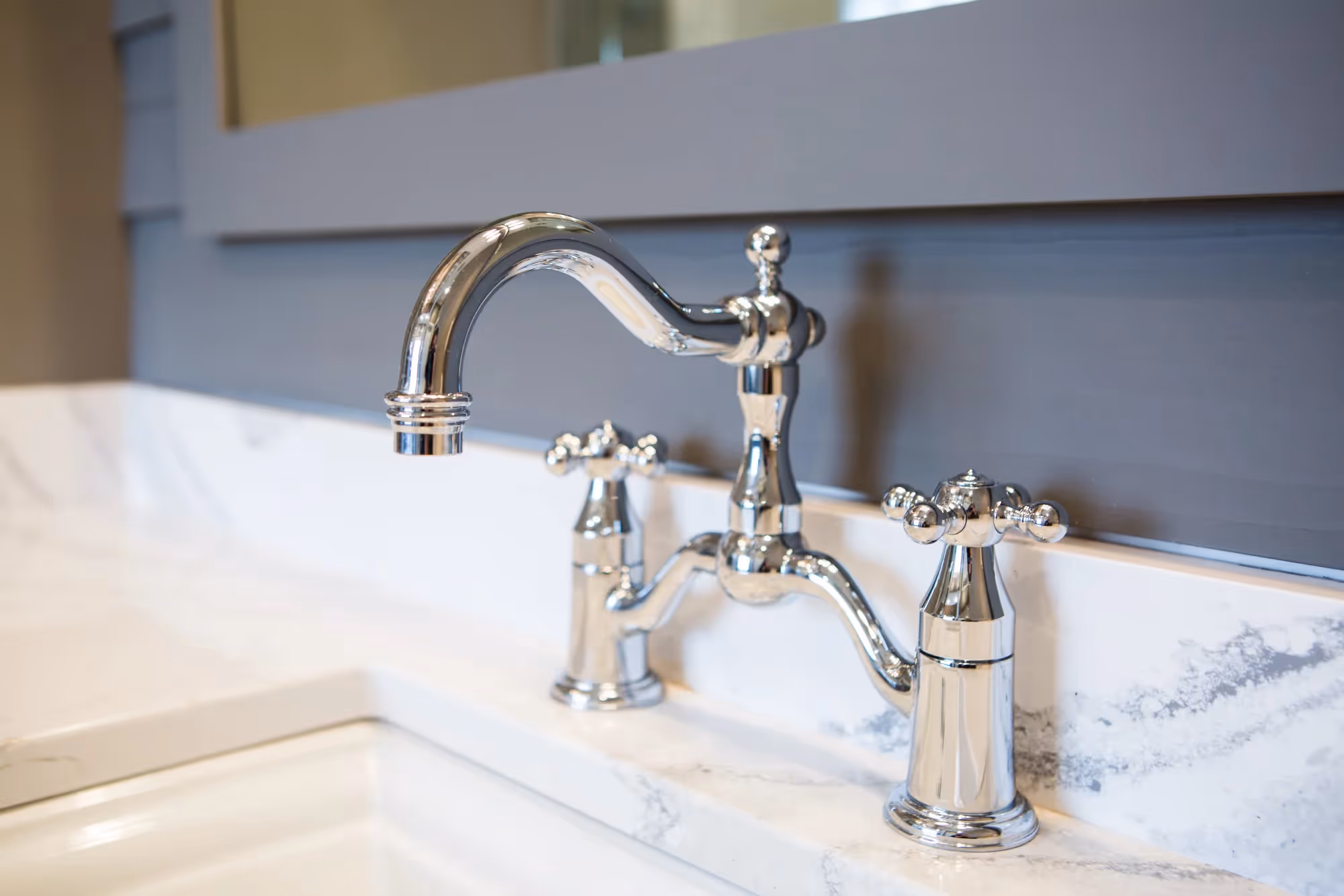 Sink with curved faucet and countertop