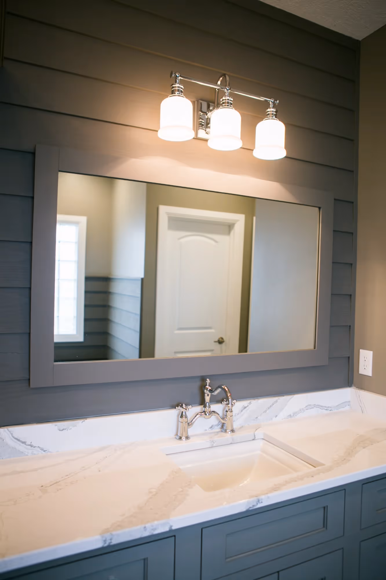 Modern bathroom vanity with illuminated mirror and sink