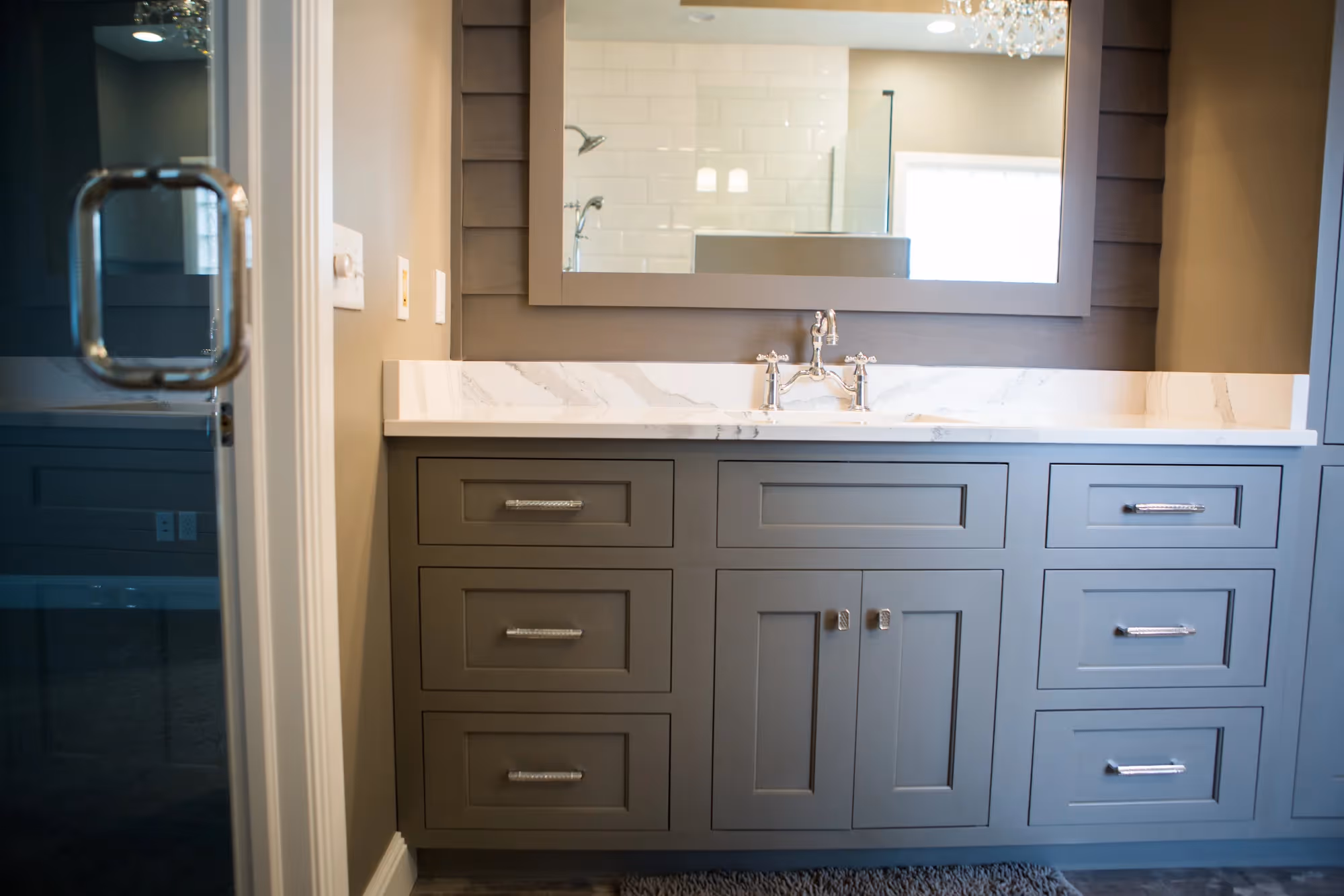 Bathroom vanity with double sinks and dark cabinets