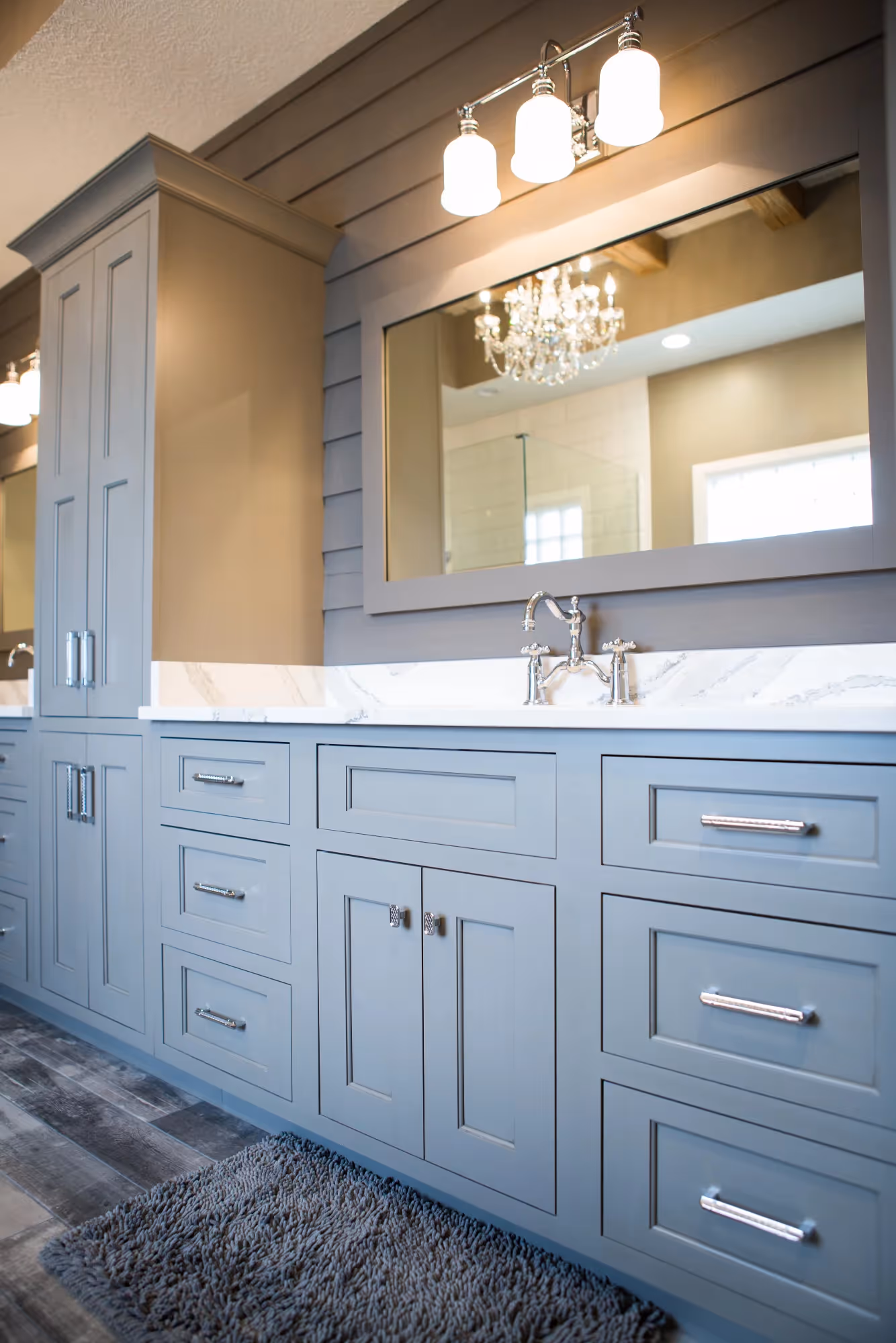 Bathroom with dark double-sink vanity and bright lighting