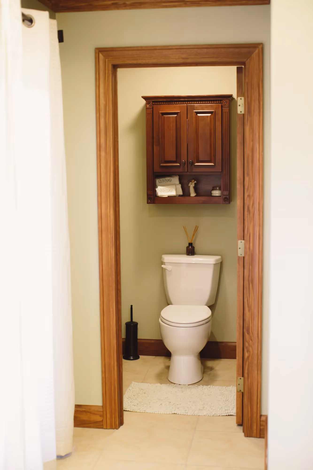 Toilet and towel rack in a narrow bathroom corner