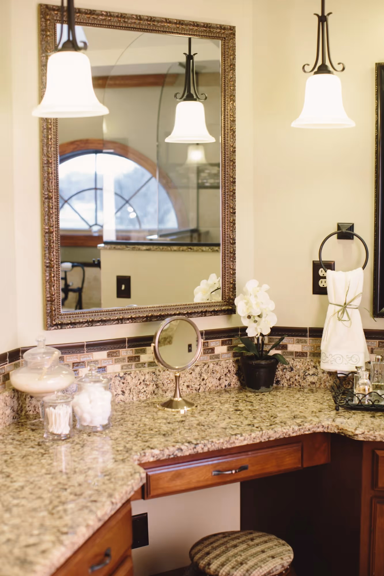 Bathroom vanity with large framed mirror and single sink
