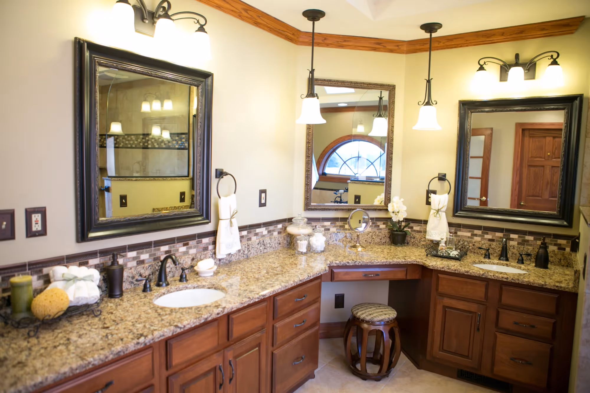 Bathroom vanity with granite countertop and framed mirror