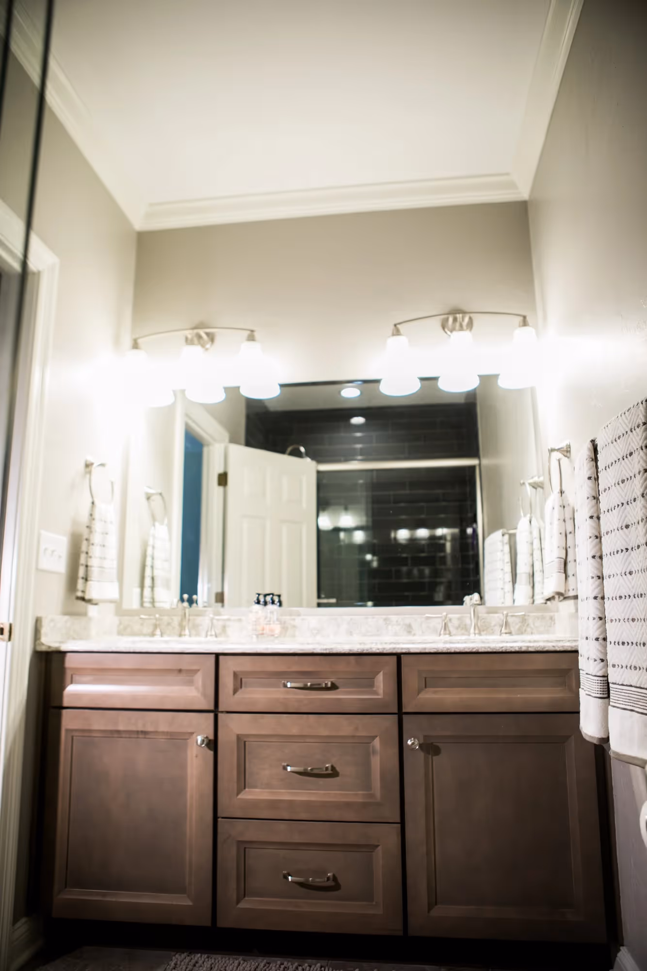 Bathroom with double sinks and wall mirror.