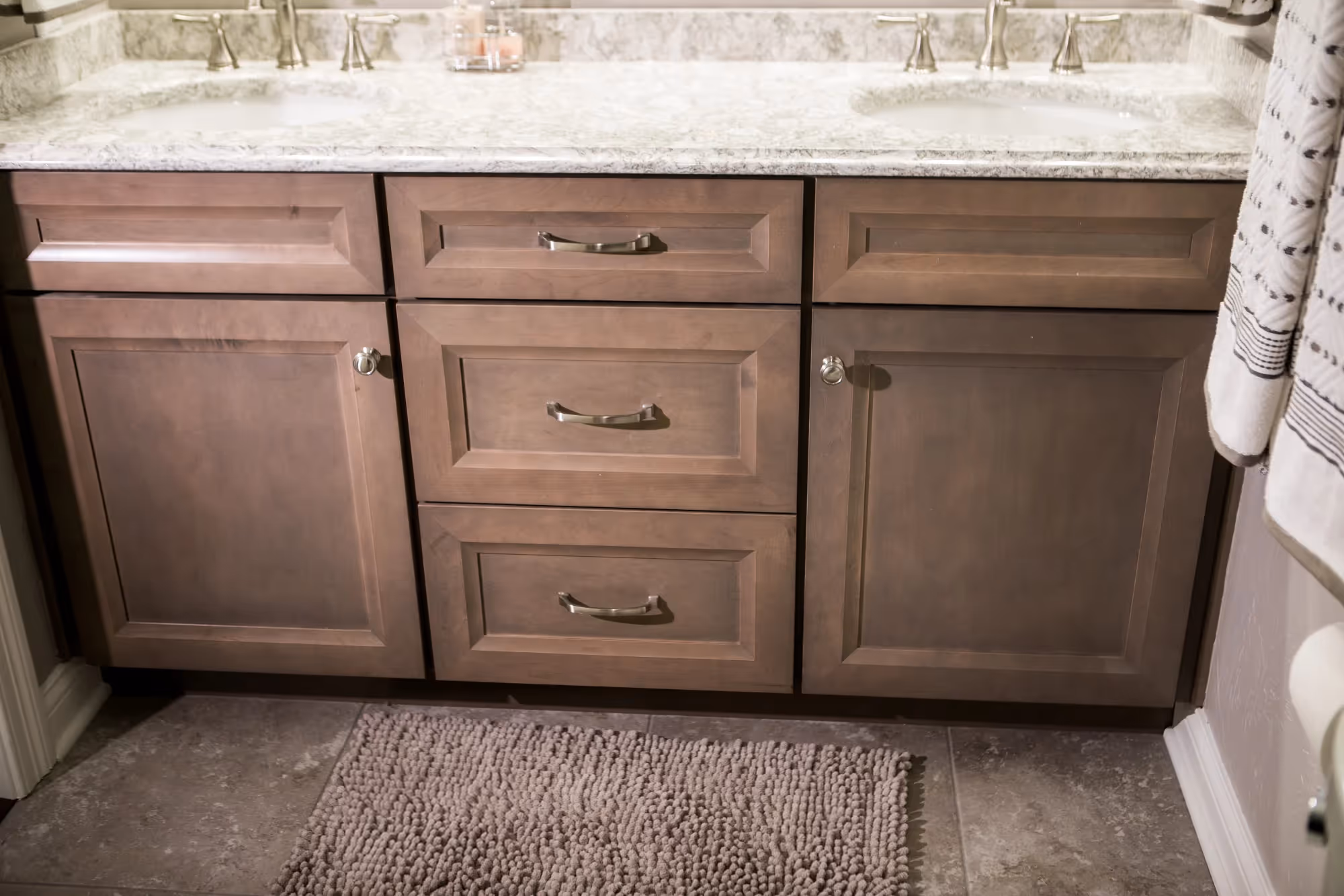 Close-up of wooden vanity drawers and cabinet.