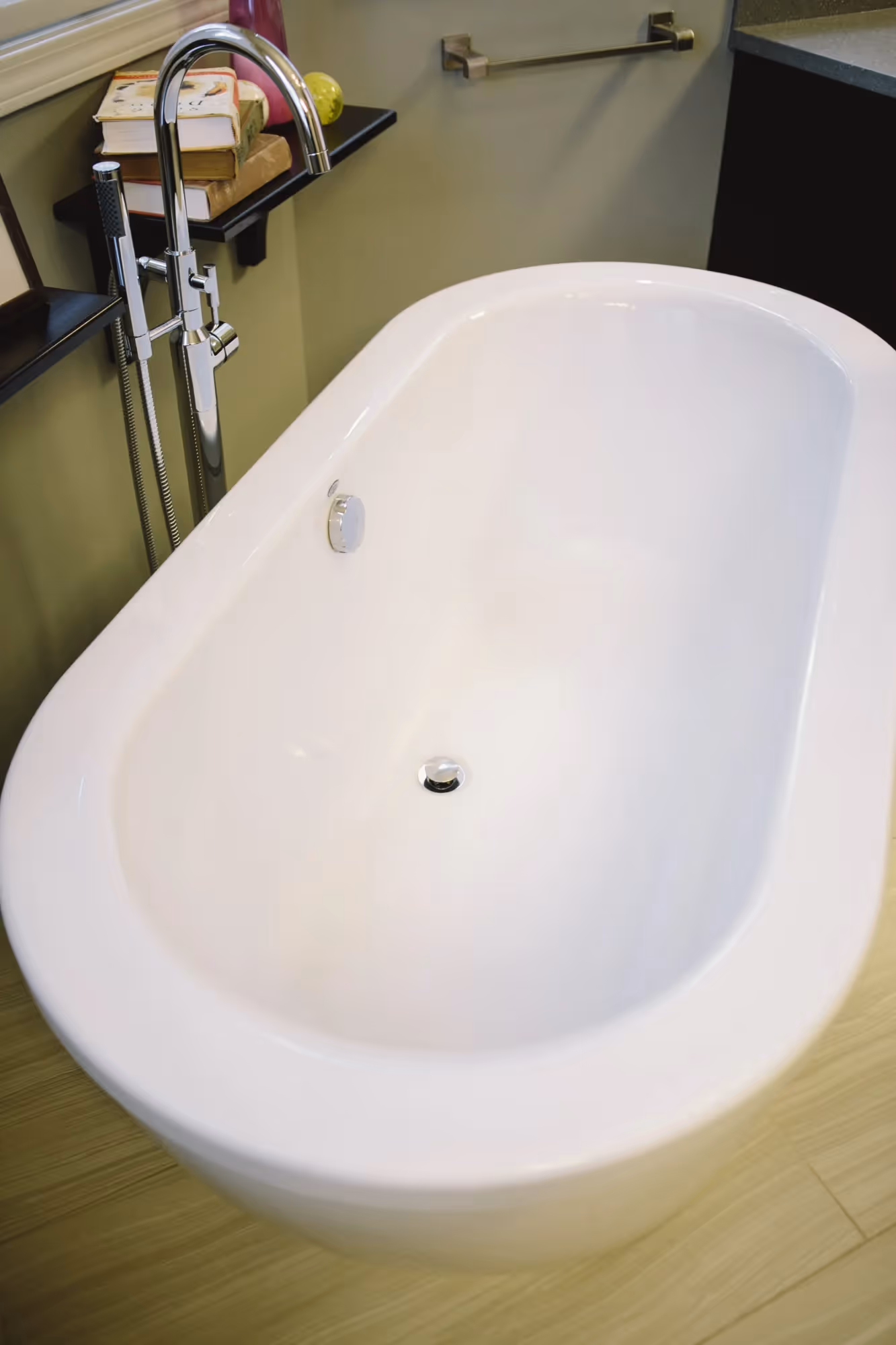 White freestanding bathtub in a modern bathroom.