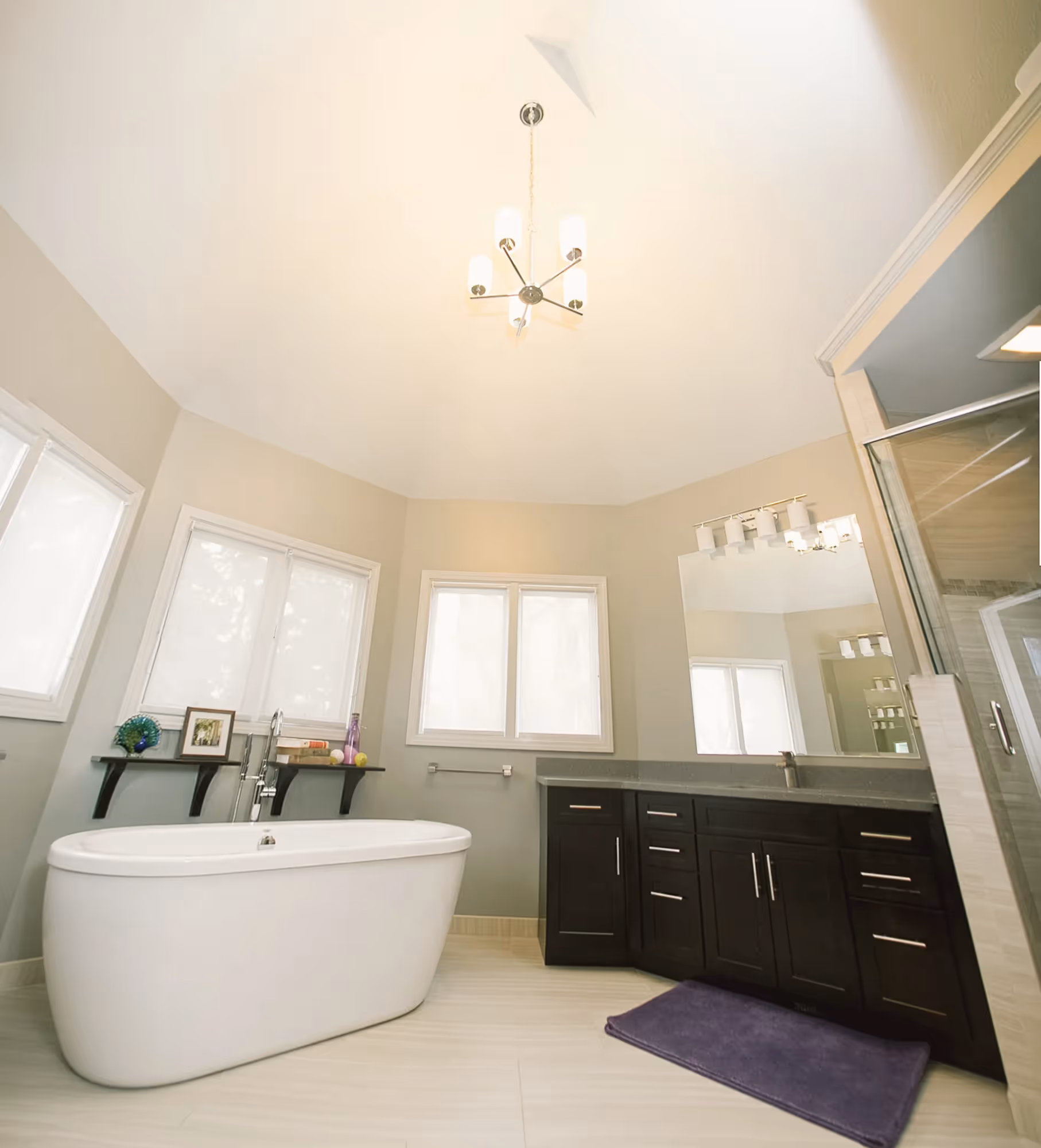 Modern bathroom with double sinks and mirrors.