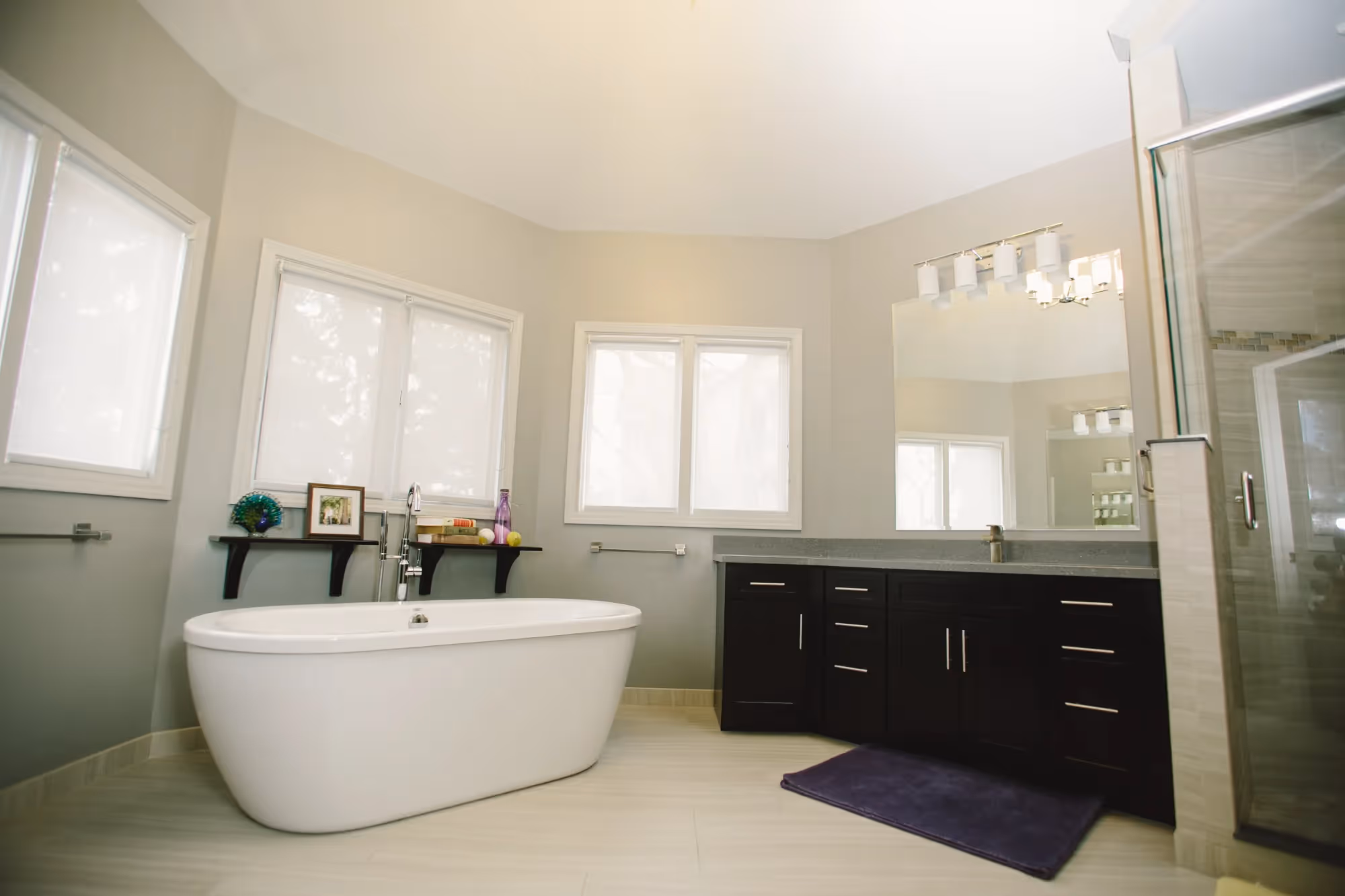 Spacious bathroom with double vanity and large mirrors