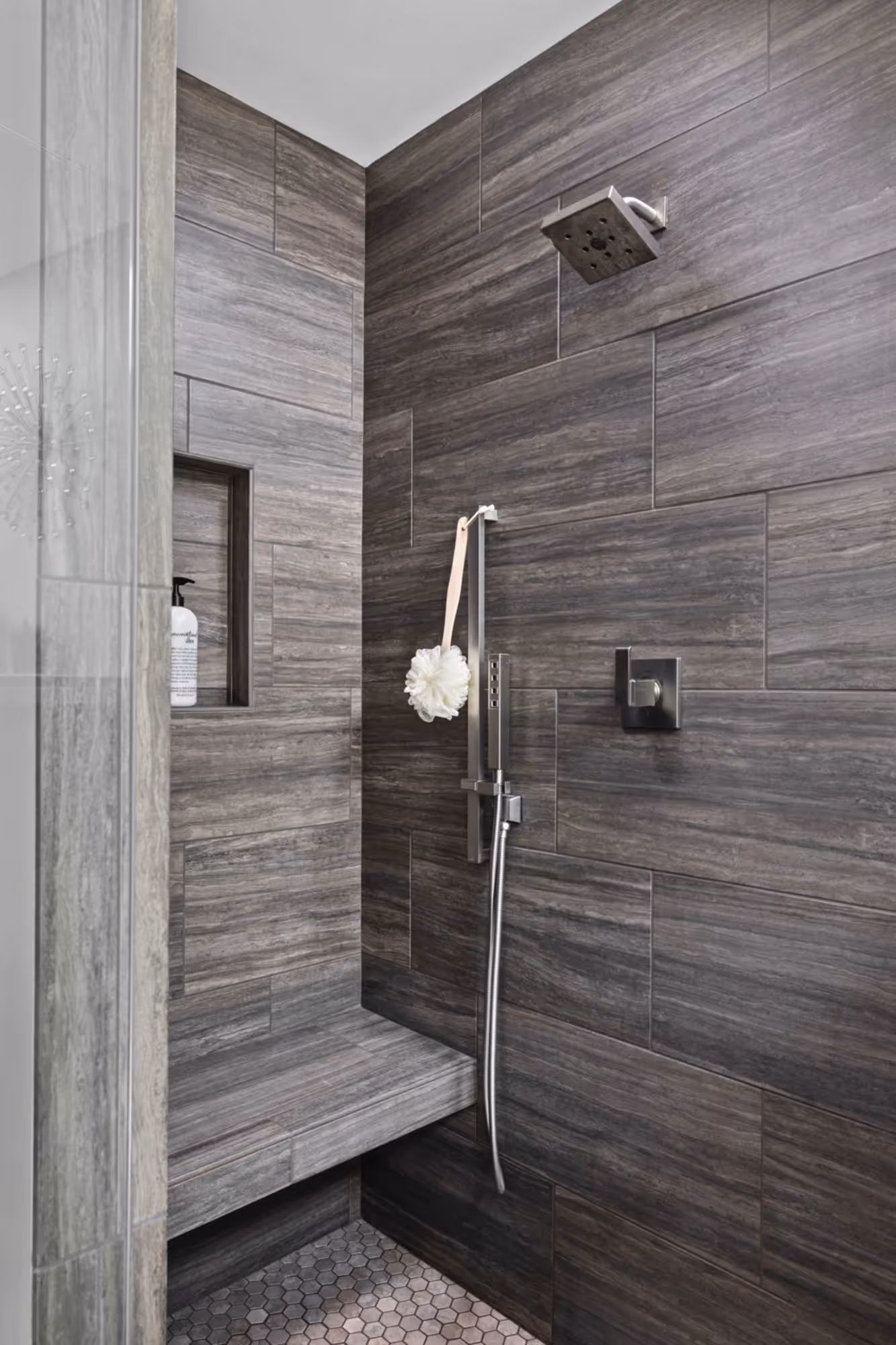 Tiled shower with glass enclosure