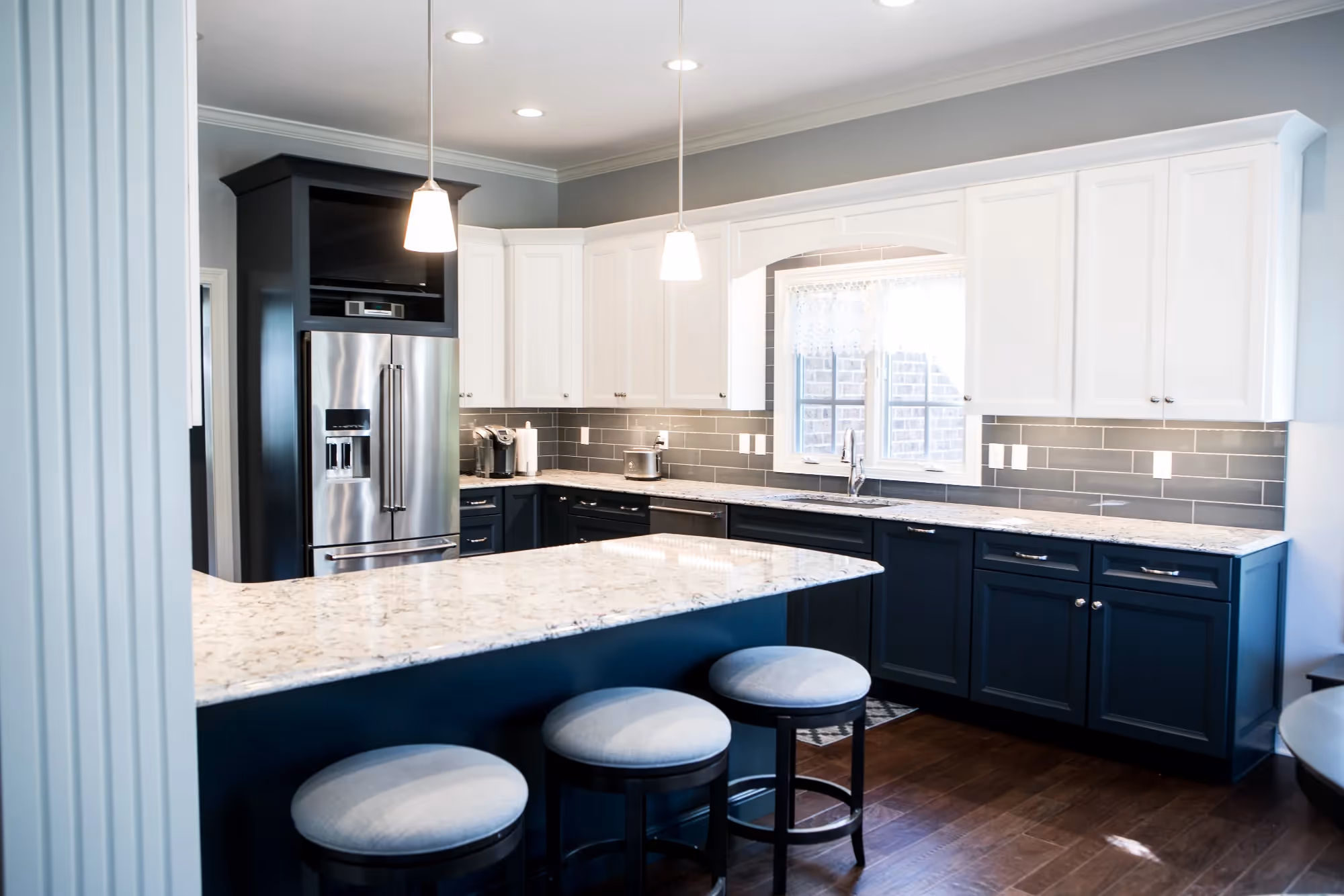 Spacious kitchen with blue accents and dining area