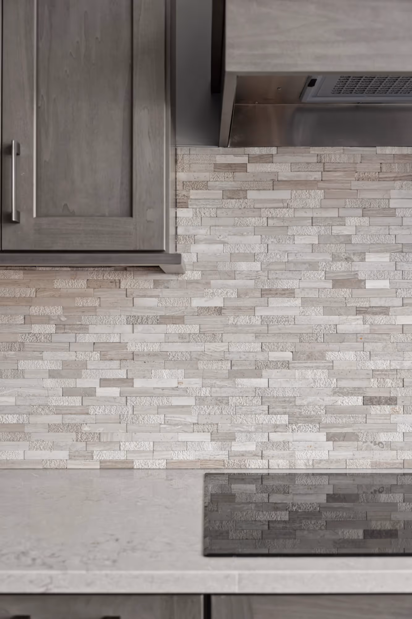 Lower cabinetry and tile flooring