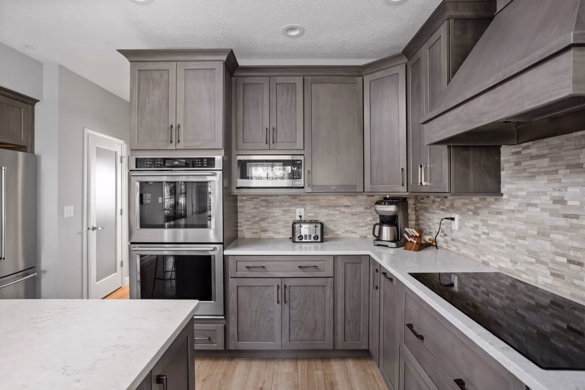Contemporary kitchen with gray cabinetry