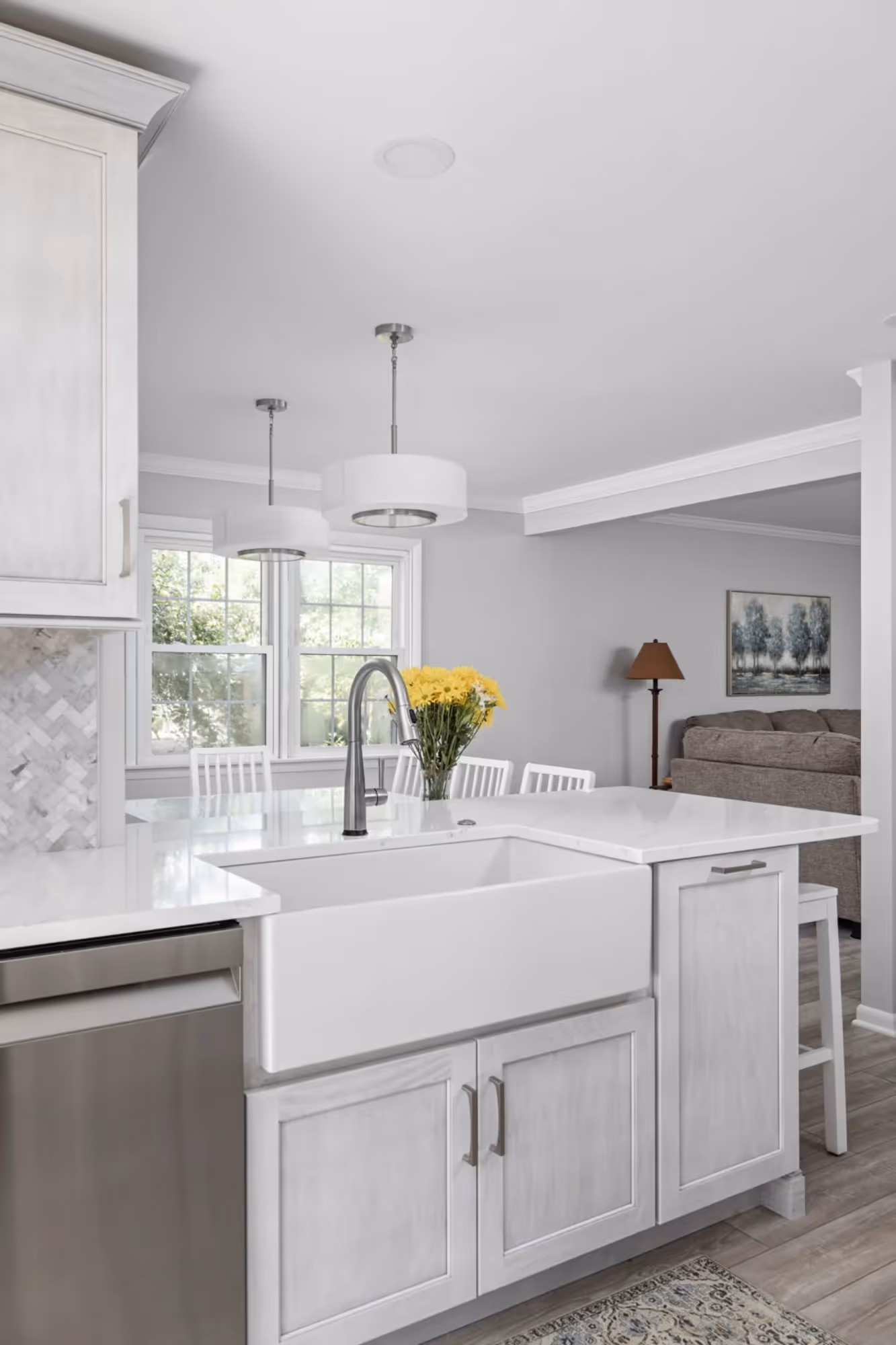 Modern kitchen with white cabinets and stainless-steel appliances