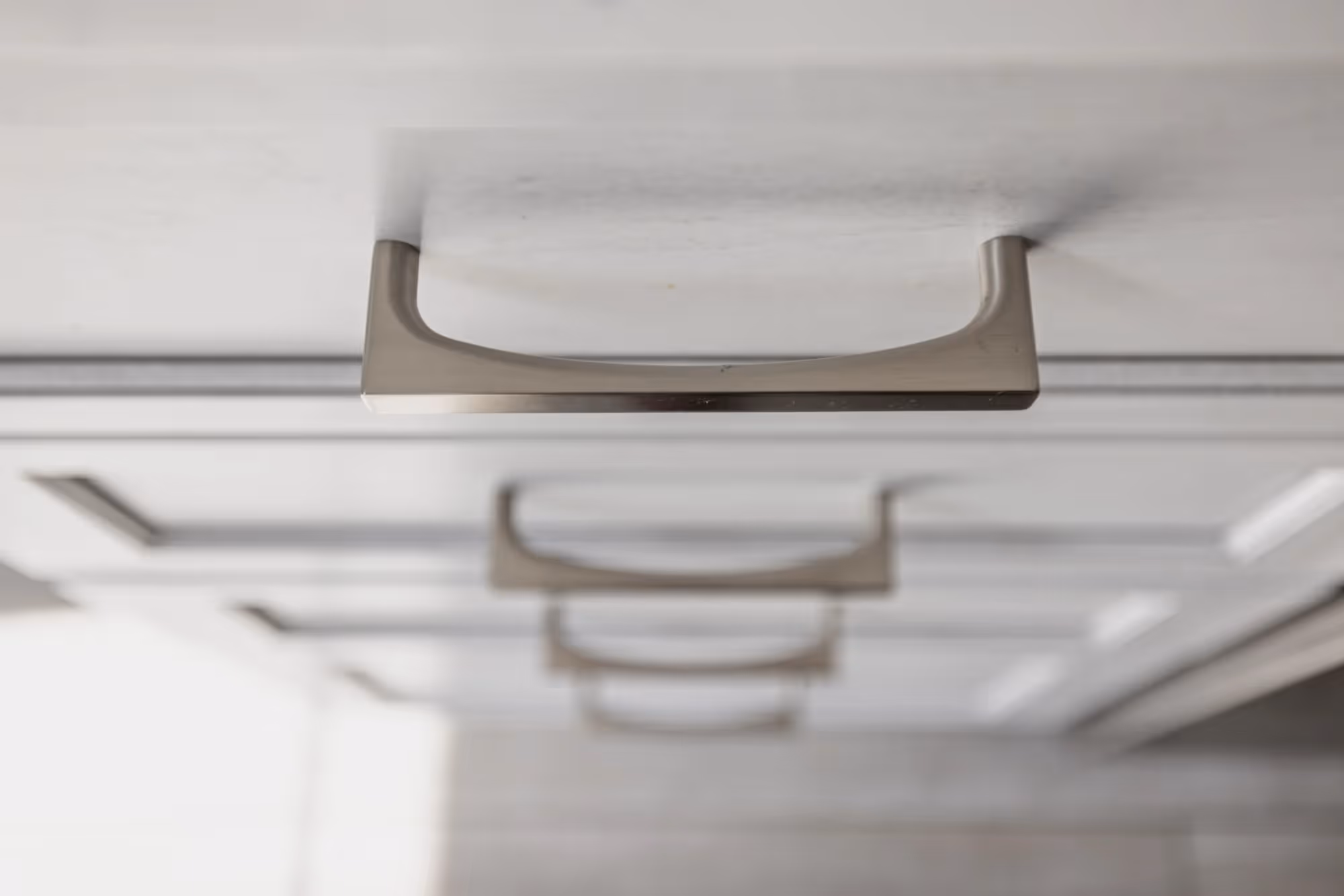 Close-up of a brass handle of drawers.
